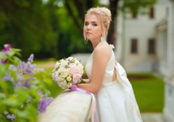 Bride posing in a garden setting